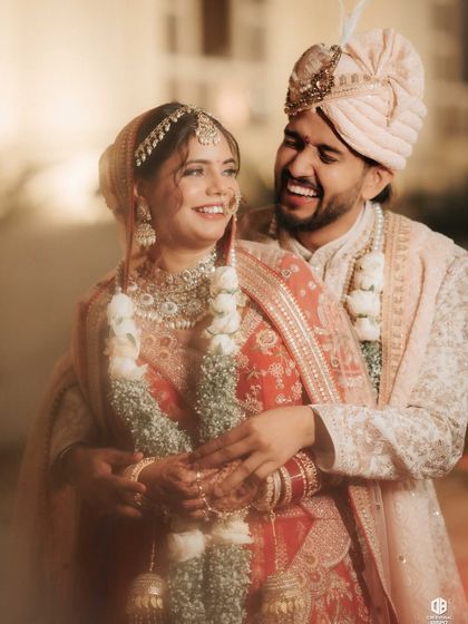 A happy moment between the bride and groom. My goal is to create a look that feels comfortable and lets your natural happiness shine through.