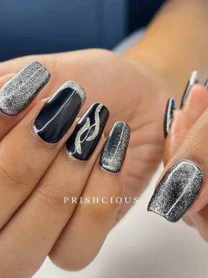 Bringing the catwalk to her nails with this black and silver cat eye design. I combined it with a silver glitter accent nail and some abstract line work.