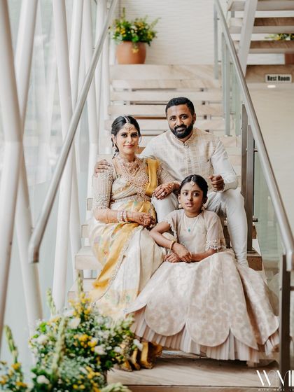 A formal family portrait. The cream and yellow color scheme of our outfits creates a warm, cohesive look for this memorable day.
