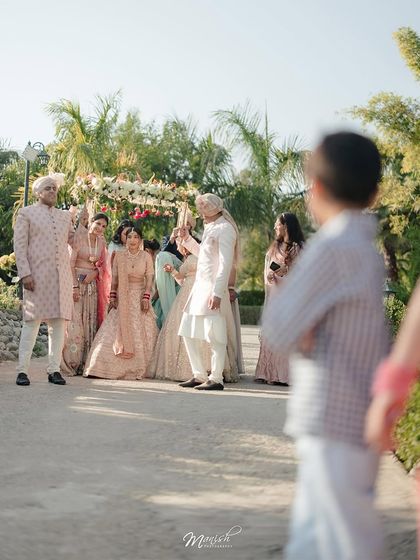 A candid, documentary-style shot of the wedding ceremony, capturing the event from a unique and personal perspective.
