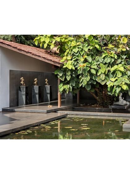 The "Rishi Pavilion" at the museum, where busts of the founders are displayed. A lotus pond and an old tree are integrated into the design, creating a tranquil and reflective atmosphere.