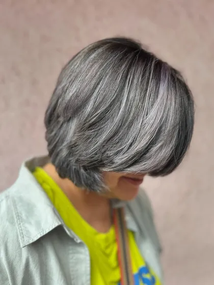 A side view of the frosty silver bob. The color is cool and chic, and the cut is timeless.