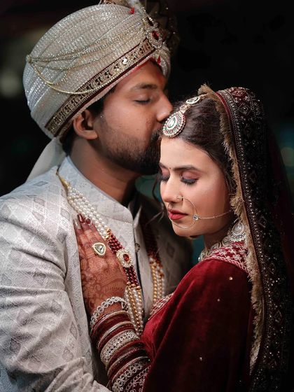 A tender moment. The makeup is designed to last through all the emotional moments of a wedding day.