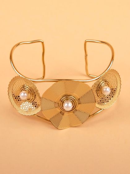 A front view of the gold-tone floral cuff bracelet.