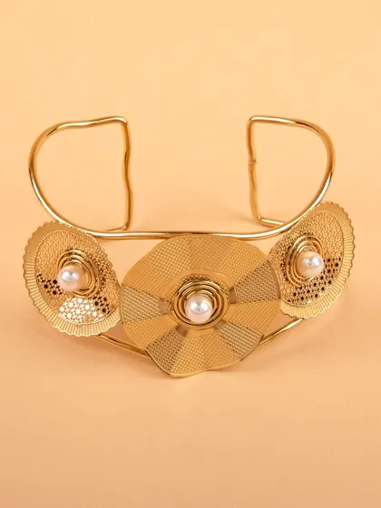 A front view of the gold-tone floral cuff bracelet.