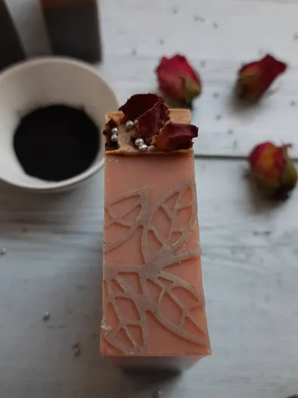 This bar shows the intricate details of the stamping. The combination of French pink clay and activated charcoal helps to gently detoxify the skin.