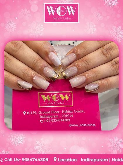 These square extensions feature a milky white base with delicate gold foil accents at the cuticle. It's a modern and sophisticated take on a neutral nail, perfect for any occasion.