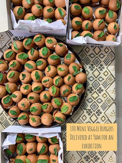 An order of 100 mini veggie burgers, delivered fresh at 9 AM for an exhibition. I can handle early morning and bulk orders for any event.