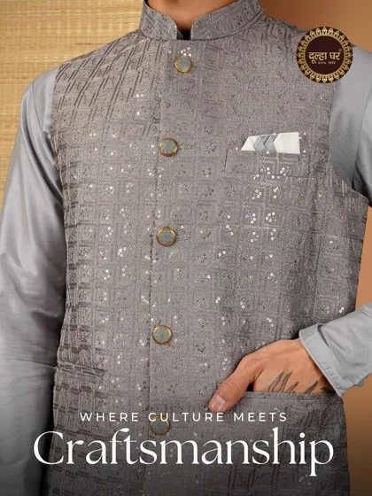 A closer look at the artistry that goes into each garment. This grey Nehru jacket features a geometric pattern with mirror work, demonstrating my commitment to high-quality craftsmanship and unique design.