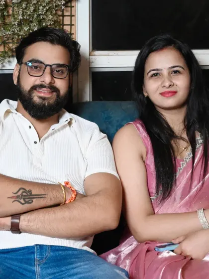 A couple relaxing and posing for a photo at their event. I aim to make people feel comfortable in front of the camera.