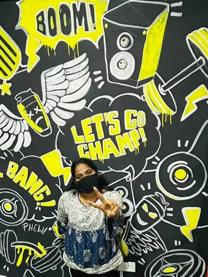 Here I am with a finished wall doodle for a gym in Bengaluru. This high-energy, graphic style is perfect for motivating spaces, using bold typography and pop-art illustrations to make a powerful statement.