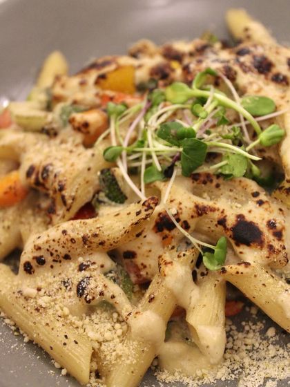A close-up of our Baked Pasta, with its perfectly charred top and creamy sauce. It's a dish that proves healthy food can be incredibly indulgent.
