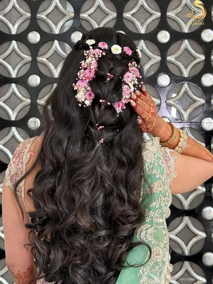 A close-up of the intricate floral braid, showing the beautiful mix of pink and white flowers.