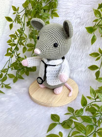 Dr. Mouse! This was a custom order for a graduation gift. The mouse is dressed in a doctor's apron with a tiny stethoscope and comes on a wooden base to be a display piece.