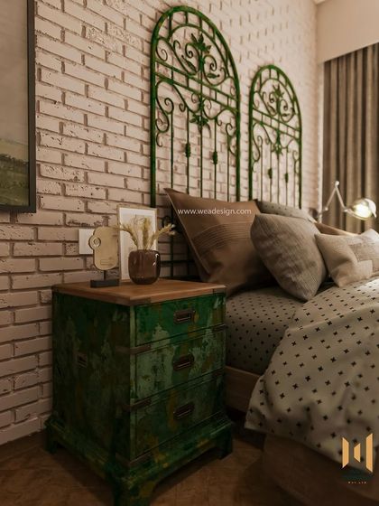 Another angle of the vintage-inspired bedside table against the textured brick wall.