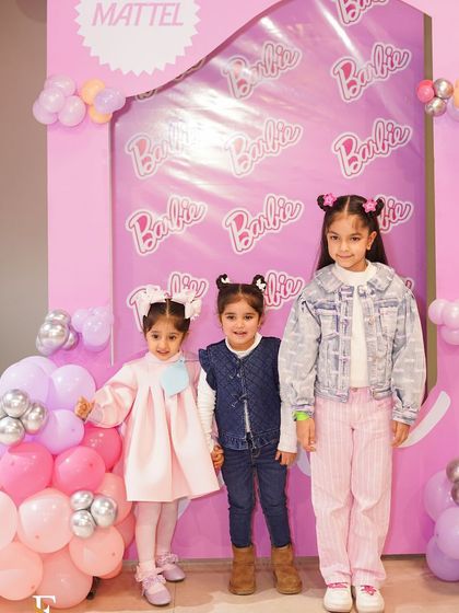 Little guests dressed up and ready to party at a Barbie-themed celebration. We love seeing the children's excitement as they arrive.