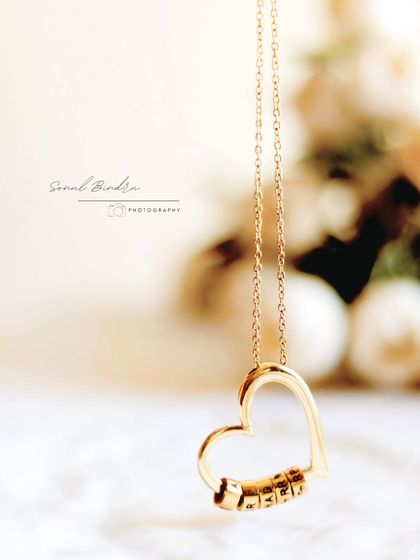 It took patience to get this heart pendant to hang perfectly still, catching the light just right. Using a soft white cloth and diffused window light, I aimed for a quiet frame that feels both warm and delicate.