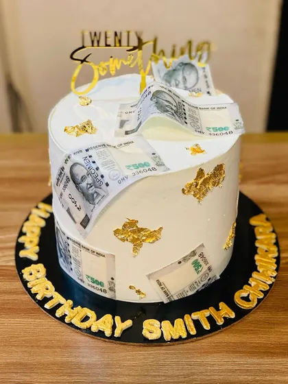 Add a fun surprise to your celebration with a money-pulling cake. This one features edible currency notes hidden inside, making for an exciting reveal. It's a great way to make birthdays and special announcements even more memorable.