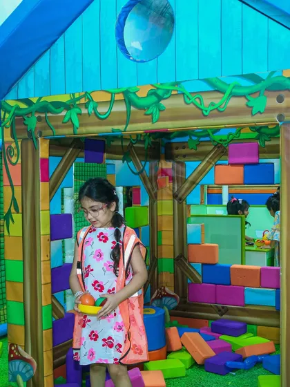 Building and creating with soft blocks. This activity helps toddlers develop their fine motor skills and creativity.