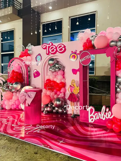 An angled shot of the Barbie stage, highlighting the glossy, patterned floor and the fun palm tree cutouts that add a Malibu vibe.