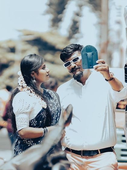 A cool, retro-inspired shot of a couple shopping for shoes on a busy street, capturing a candid and stylish moment.
