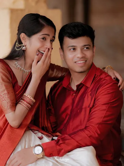 A candid moment of laughter and surprise, capturing the genuine, unscripted joy between a couple.