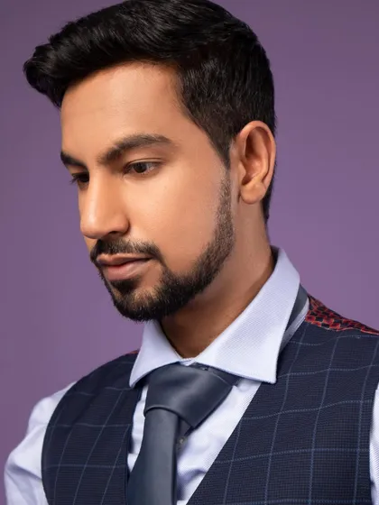 A close-up professional portrait. The lighting is soft but directional, highlighting the features without harsh shadows. This is a great look for a LinkedIn profile.