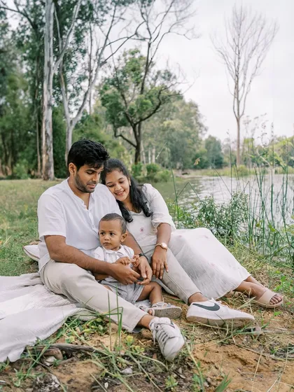 A family portrait by the lake with their two-year-old son. It's wonderful to see families come back and continue their tradition of yearly photos.