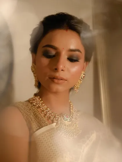 The use of a prism creates a dreamy, ethereal effect in this shot, highlighting the soft glow on the skin.