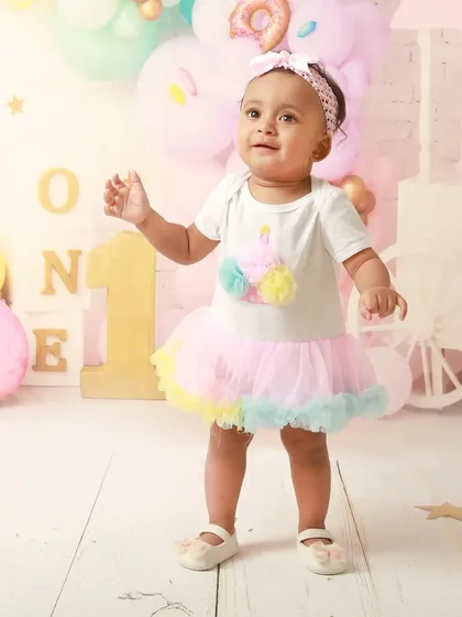 A sweet-themed birthday for a sweet little girl. This donut and ice cream setup is a colorful and fun way to celebrate turning one.