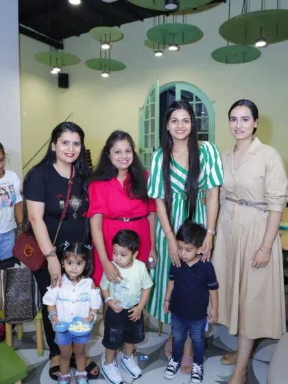 A group of moms and their little ones pose for a photo in our dining area. It's the perfect spot for a playdate meetup.