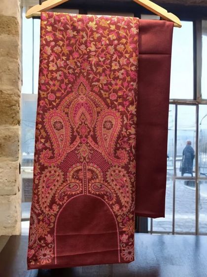 Beautiful warm suits to make your winters full of warmth and brightness. This maroon pashmina fabric has a stunning all-over print.