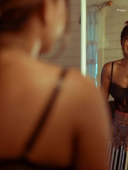 A joyful and candid reflection in the mirror. Capturing genuine laughter is one of the best ways to show personality.