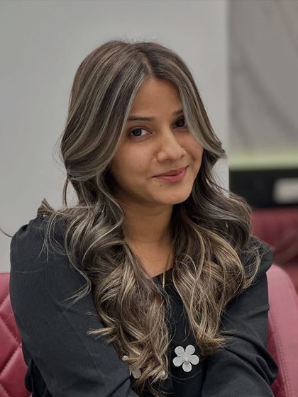 A perfect portrait of our client enjoying her first-time ash blonde experience.