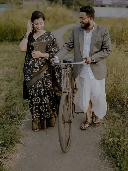 A retro-themed pre-wedding shoot with a vintage bicycle in a rustic setting. This shows how we can create a unique, old-world charm for your photos.