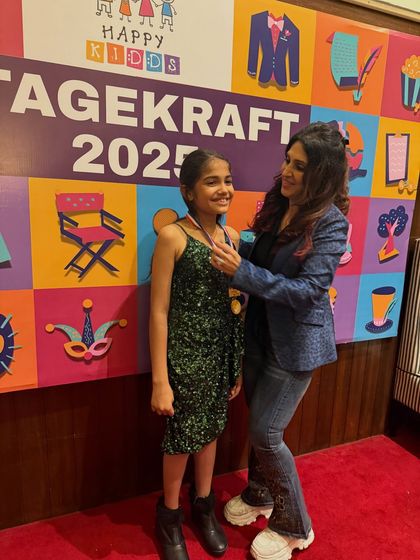 Placing a medal on a student is one of the most rewarding moments, recognizing her hard work and brilliant performance.