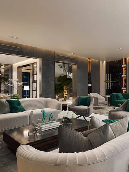 An expansive living area designed with multiple seating groups to accommodate large gatherings. We used a consistent palette of grey and emerald green to unify the different zones, creating a sophisticated and cohesive environment.