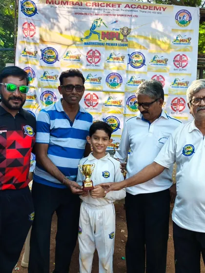 Presenting the 'Man of the Match' trophy to Aarav Namjoshi for his performance in the U-12 Masterstroke Premier League.