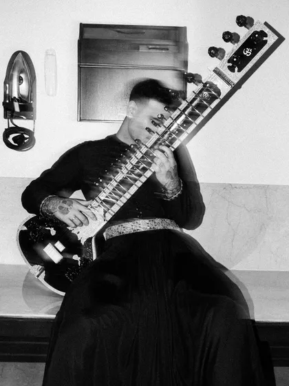 A double-exposure black and white shot, creating a feeling of movement and vibration, as if the music is visible.
