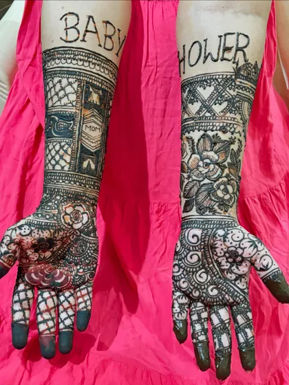 I love making your mehendi personal. This custom design was for a beautiful mom-to-be, with "Baby Shower" written across her arms. We can incorporate any name, date, or special message into your henna.
