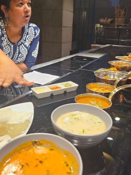 Explaining the different dishes laid out for a tasting at The Lodhi, New Delhi. From the light Pandra Rassa to the spicy curries, each dish tells a story about the flavours of Maharashtra.