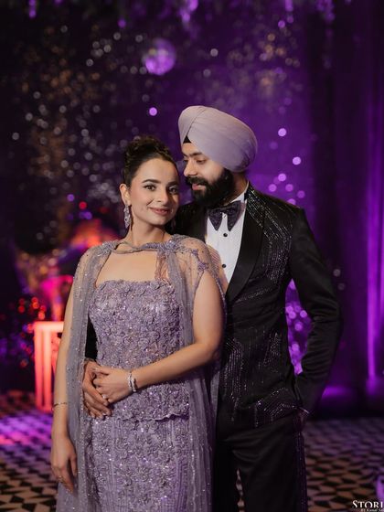 A stylish portrait from a cocktail night, with the purple lighting and decor adding a modern and chic vibe.