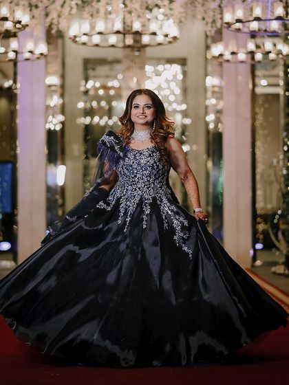 The bride twirling in her magnificent ball gown on the red carpet.
