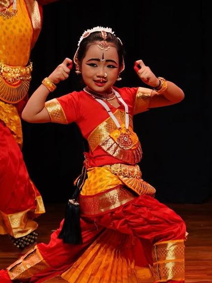 The joy of dance shines on this young student's face. Abhinaya is not just about serious emotions; it is also about expressing happiness and celebration.