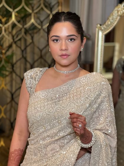 A powerful and elegant portrait. This look features a clean, minimal aesthetic with a focus on flawless skin and a simple diamond choker, proving that sometimes less is more.