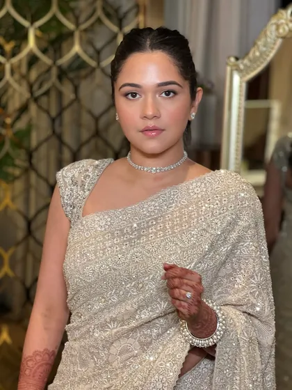 A powerful and elegant portrait. This look features a clean, minimal aesthetic with a focus on flawless skin and a simple diamond choker, proving that sometimes less is more.