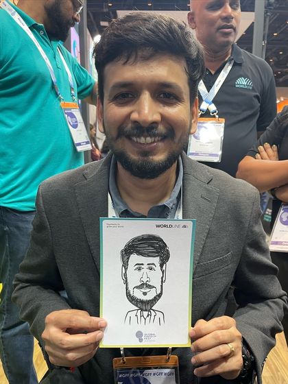 A happy guest at the Jio World Convention Centre. Our caricatures are a popular attraction at large scale corporate events.