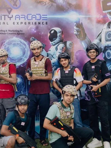 A team of players poses in front of our space-themed backdrop after a thrilling game. This is a great photo opportunity and a perfect way to remember an epic team-building activity.