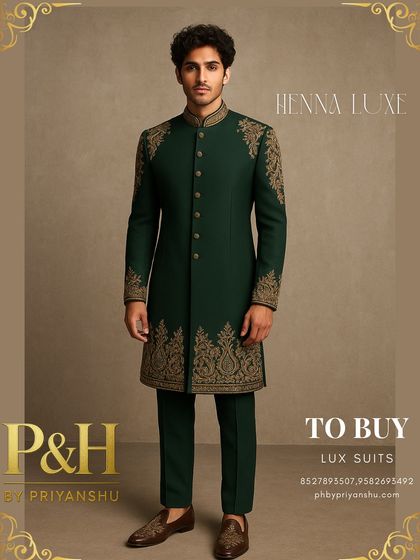A full-length view of the heavily embroidered green suit, showcasing its majestic and powerful silhouette.