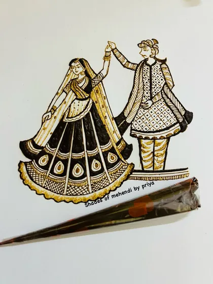 A close-up of a dancing couple sketch from my practice book. I place a mehendi cone next to it to show the tool of our art.